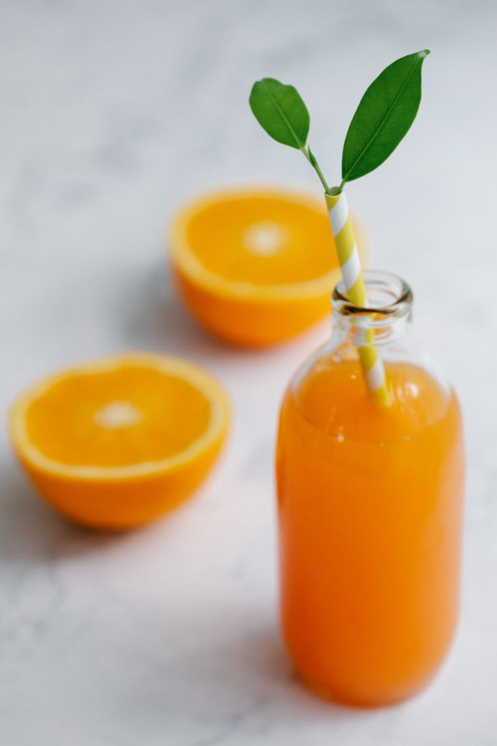 Sea buckthorn-style juice in a glass bottle